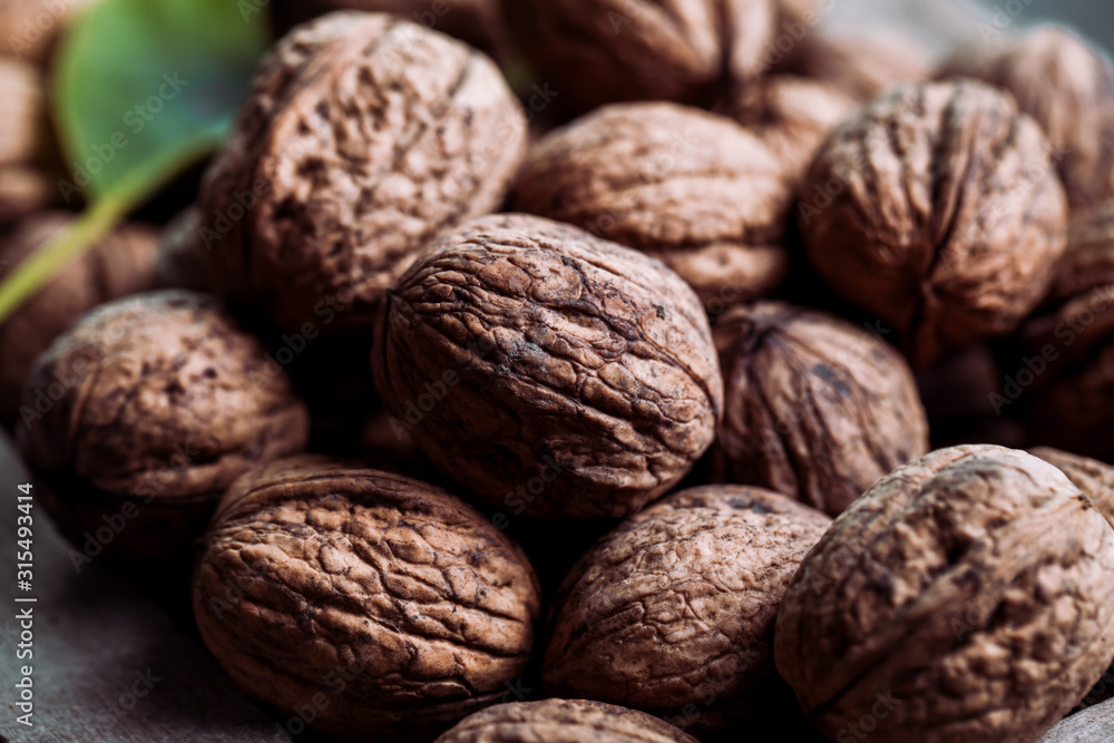Walnuts with and without shells (filling the picture). Background of fresh walnuts. Walnuts with and without shells (filling the picture). Background of fresh walnuts.