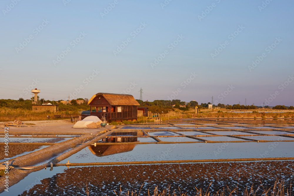 Salt fields at sunset in Cervia, Ravenna Province, Italy Salt fields at sunset in Cervia, Ravenna Province, Italy