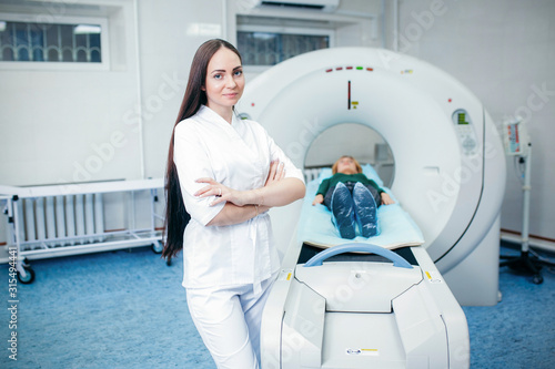 Doctor analyzes the patient on CT Scan in modern hospital