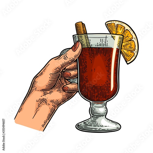Female hand holding a glass of wine. Vintage vector engraving i