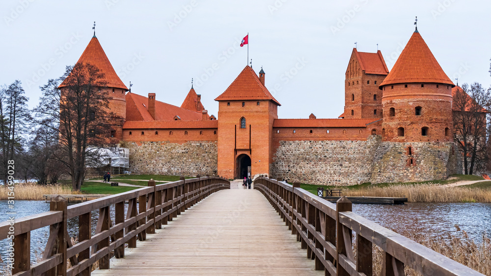 Medieval red brick castle on island in Trakai, Lithuania.