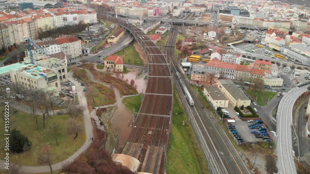 Train on Railway in Prague Suburbia, Czech Republic, Aerial View Public Transportation on Autumn Day Train on Railway in Prague Suburbia, Czech Republic, Aerial View Public Transportation on Autumn Day