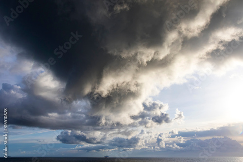 Picturesque dramatic stormy Cumulonimbus Calvus cloud formation over the Baltic sea near Helsinki  Finland. Landscape with dramatic sky over the sea