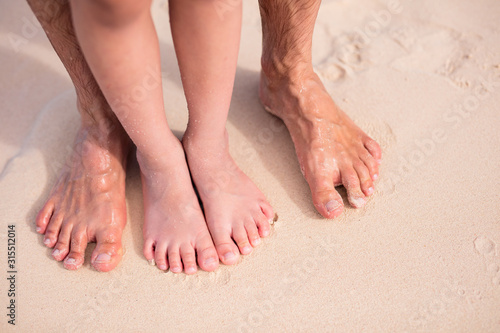 Feet on tropical sand © BlueOrange Studio