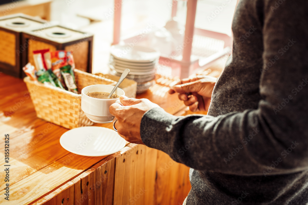 A man and coffee cup in the morning. A man and coffee cup in the morning.