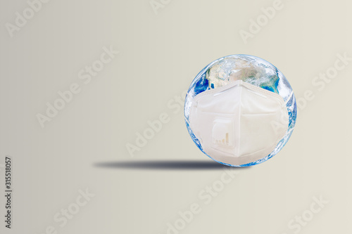 Ecology  Pollution and Environment Concept   Blue planet earth wear protective or face masks on gray background.  Elements of this image furnished by NASA. 