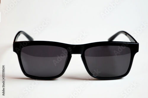 Black sunglasses, black frame isolated on a white clean background.