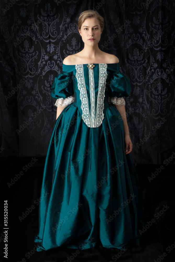 Renaissance or Victorian woman on a dark backdrop Renaissance or Victorian woman on a dark backdrop