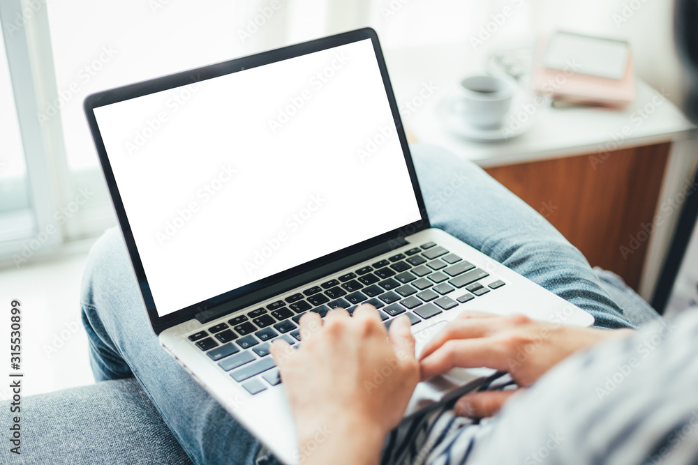 mockup image blank screen computer with white background for advertising text,hand man using laptop contact business search information on desk at coffee shop.marketing and creative design mockup image blank screen computer with white background for advertising text,hand man using laptop contact business search information on desk at coffee shop.marketing and creative design