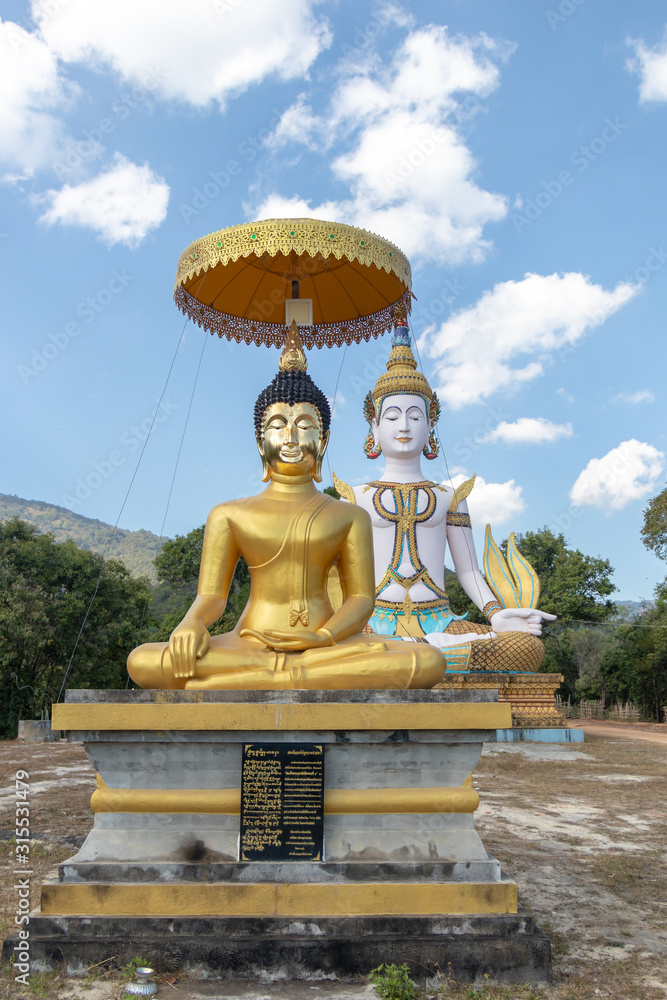 Meditation Buddha statue under blue sky with trees around Meditation Buddha statue under blue sky with trees around