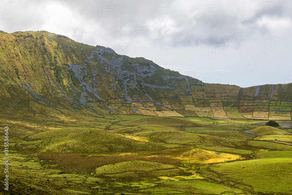 Beautiful shades of green inside the Corvo Caldera on the island of Corvo in the Azores, Portugal.