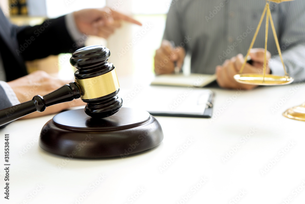Judge or lawyer talking with team or client Judge or lawyer talking with team or client