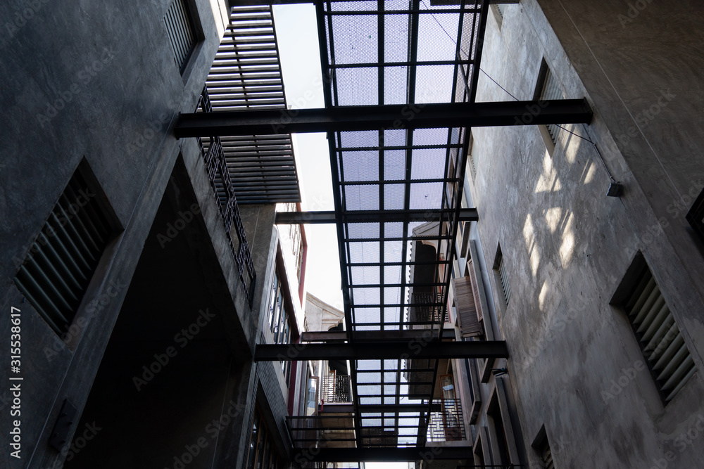Fototapeta premium The sky in alley with loft architecture Concrete Cement style . Modern chinese loft architecture background