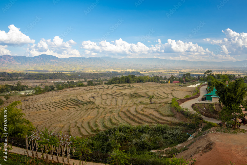 Rice filed pattern landscape view under blue sky in Keng Tung, Shan State, Myanmar Rice filed pattern landscape view under blue sky in Keng Tung, Shan State, Myanmar
