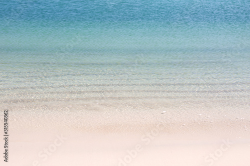 Blue sea waves summer background. Sand beach