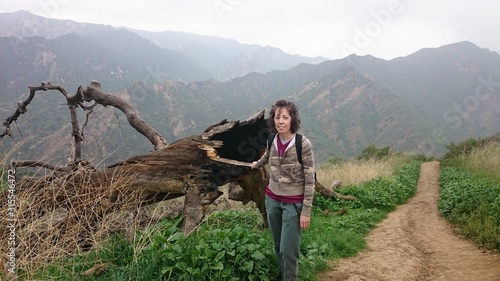 Young woman hiking through Towsley Canyon in the spring photo