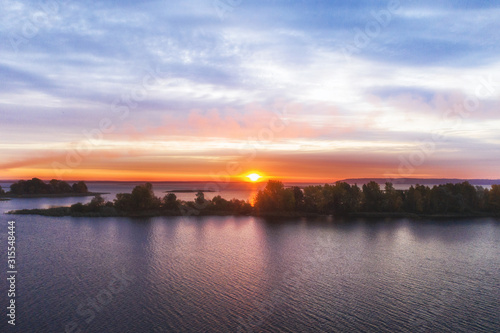 Beautiful sunrise over river with an island