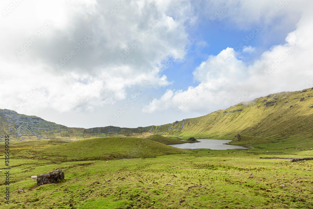 View of trekking around the basin of the Corvo Crater on the island of Corvo in the Azores, Portugal.