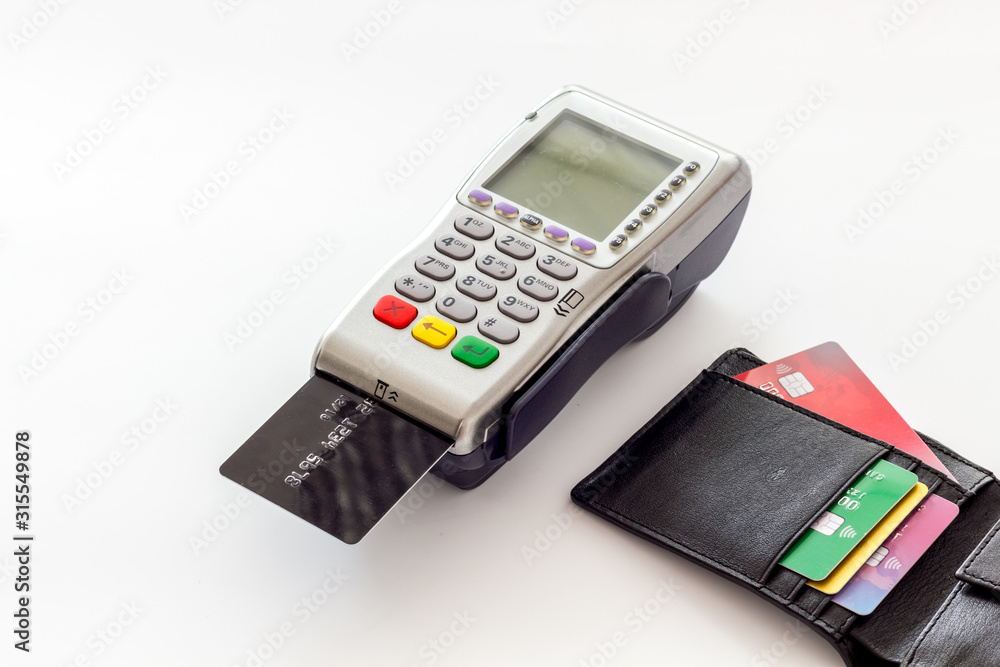 Bank terminal for payments and plastic card on white background Bank terminal for payments and plastic card on white background