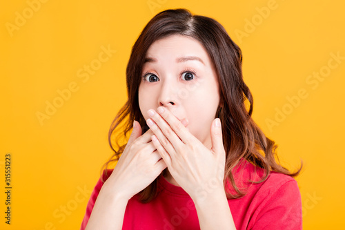 surprised young asian woman hand cover mouth