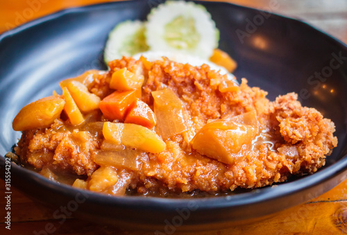 Crispy fried pork cutlet with curry and rice.