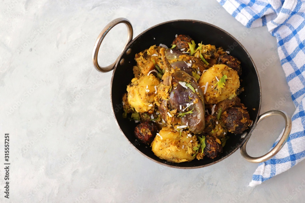 Food Traditional Indian Gujarati dish Surti Undhiyu. Its a mixed