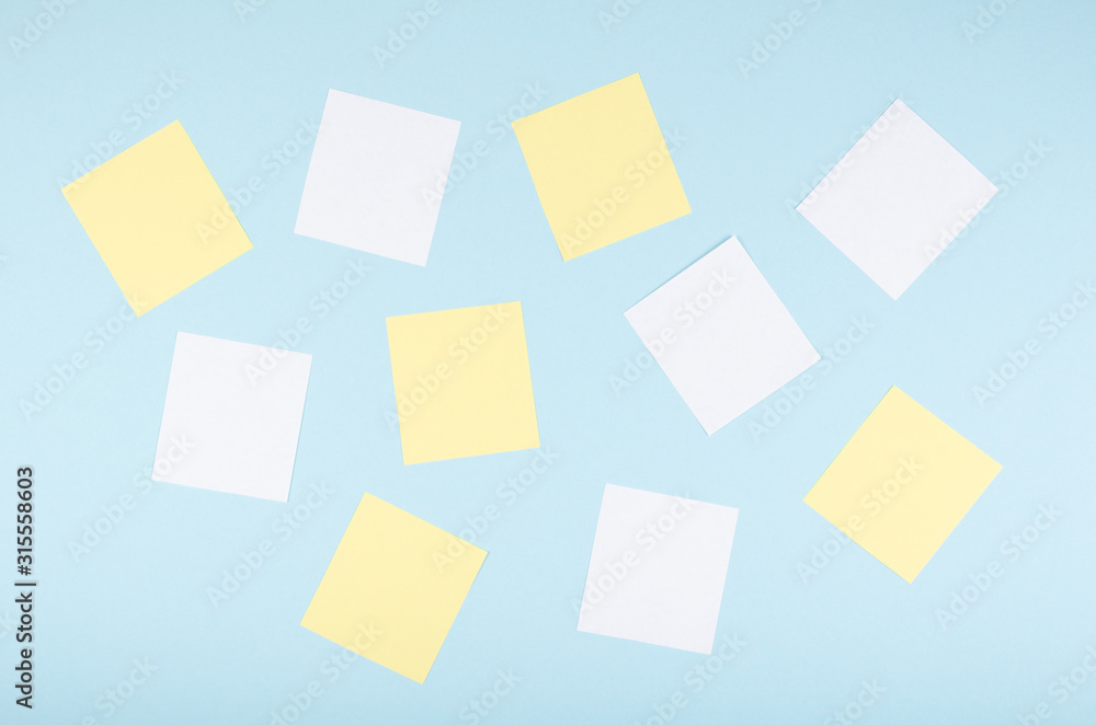 Paper notes composition on blue background. Flat lay. Paper notes composition on blue background. Flat lay.