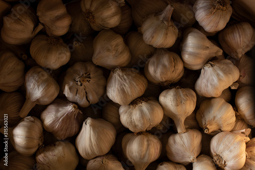 Overhead of Garlic Bulbs in Low Light