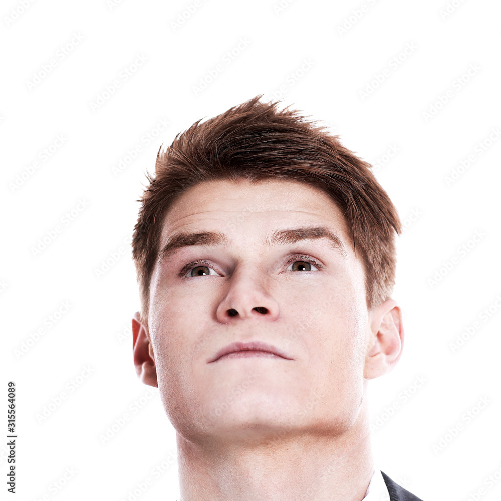 Obraz premium closeup.young man looking up at copy space