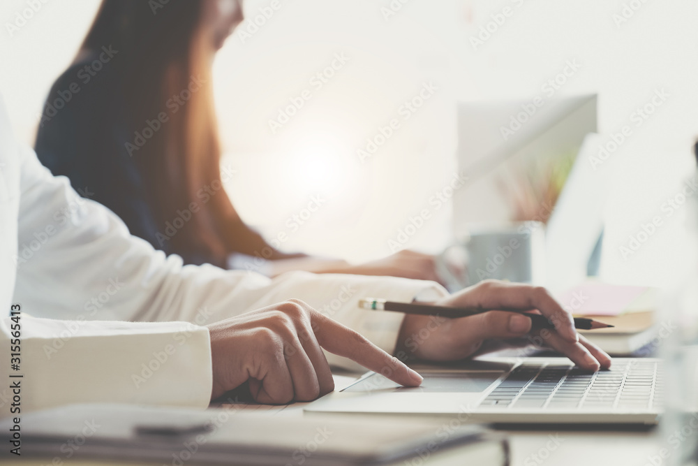 Fototapeta premium Asian Business People meeting Planning Strategy Analysis on new business project with laptop computer at modern office - Business Concept