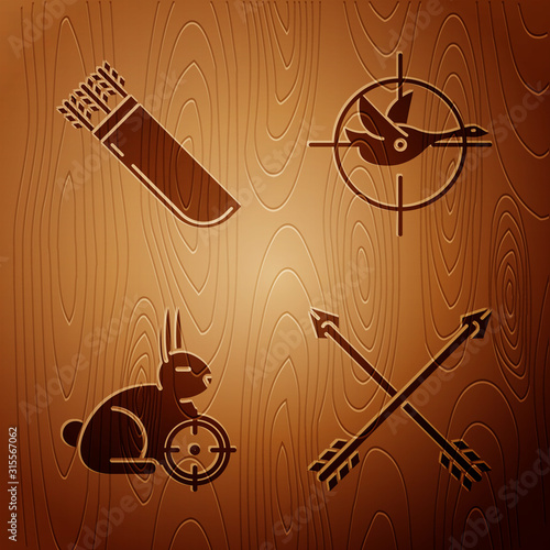 Set Crossed arrows, Quiver with arrows, Hunt on rabbit with crosshairs and Hunt on duck with crosshairs on wooden background. Vector