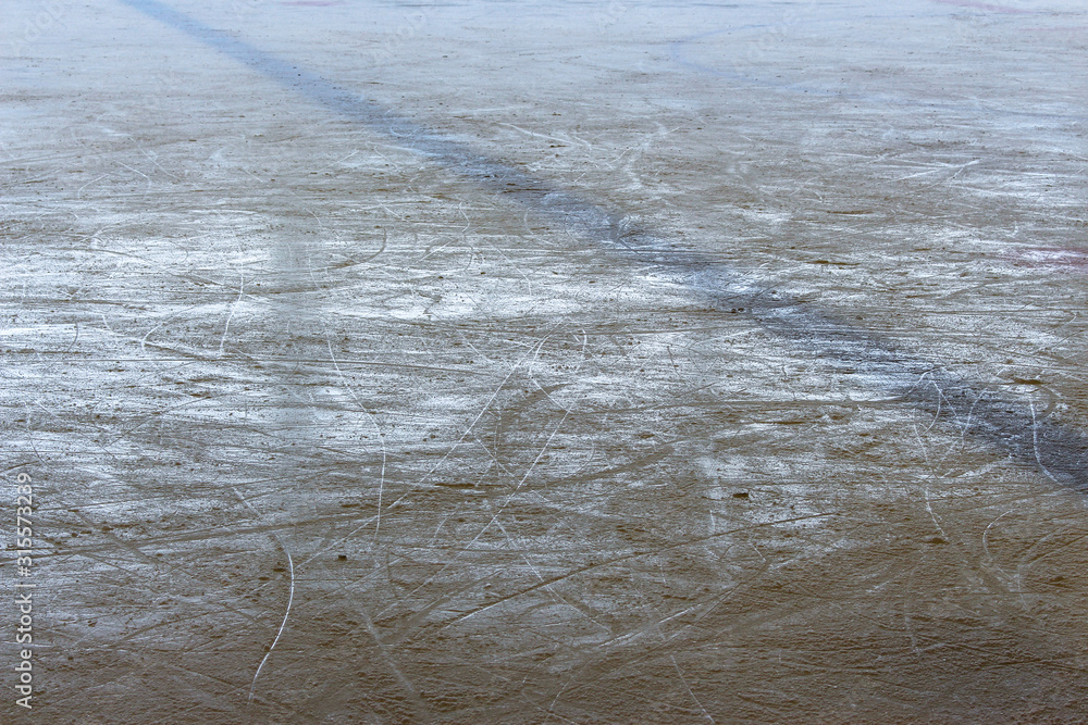 Fototapeta premium ice of the hockey arena cut by skates