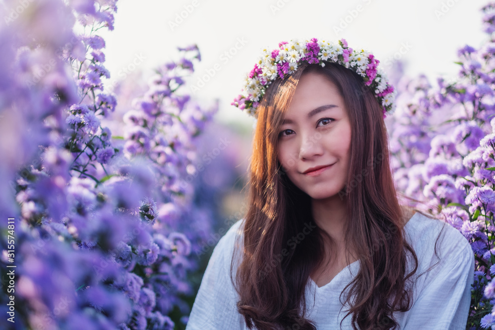 Portrait image of an asian woman in a beautiful Margaret flower field Portrait image of an asian woman in a beautiful Margaret flower field