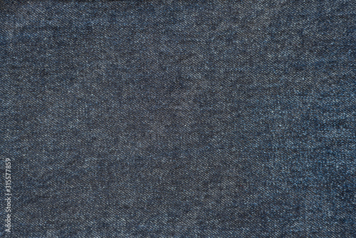 Obraz na płótnie Dark blue denim background. Closeup of jeans texture and pattern. Classic blue color w salonie