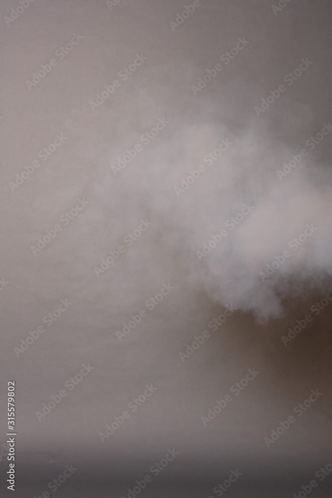 Fototapeta premium Smoke on a photographic background in the studio 50 MP