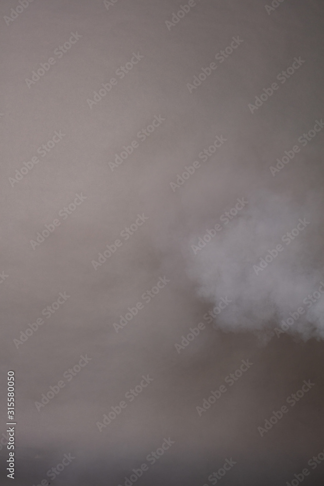 Fototapeta premium Smoke on a photographic background in the studio 50 MP