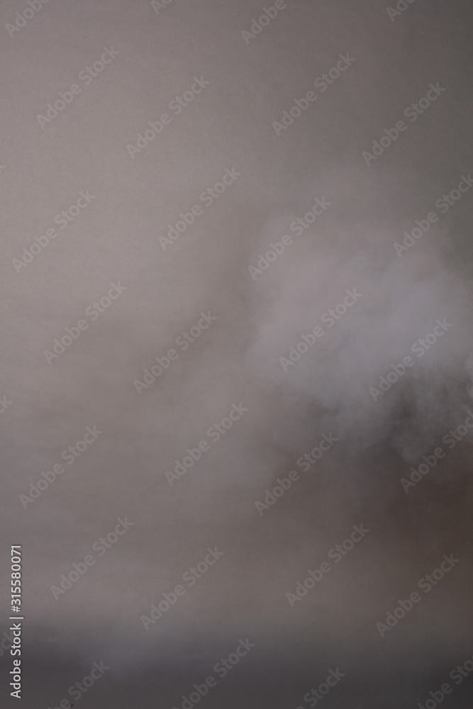 Fototapeta premium Smoke on a photographic background in the studio 50 MP