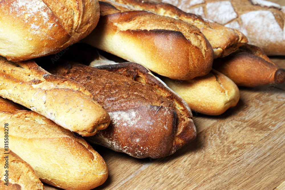 French baguettes. Fresh crisp bread. Bread background. French baguettes. Fresh crisp bread. Bread background.