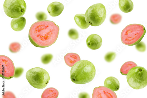 Falling guava isolated on white background, selective focus