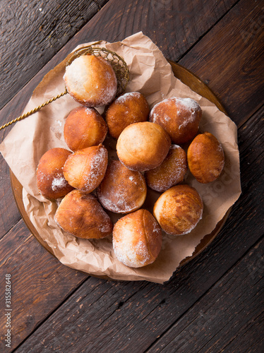 Bunuelos de viento - traditional Colombian sweet deep fried pastry. Spanish Easter doughnut. Mexican golden, crispy-sweet, tortilla-like fritters are sprinkled with sugar