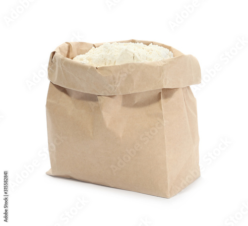 Organic flour in paper bag isolated on white © New Africa