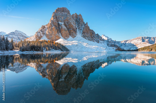 First snow Morning at Lake in Mount Assiniboine Provincial Park Canada Snow-covered winter mountain lake in a winter atmosphere. Nature in Rocky mountains. Beautiful background photo concept. photo