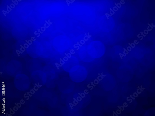 Abstract bokeh festoon on dark blue background.bokeh blurry background.