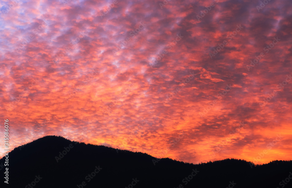 Colorful evening sky and silhouette of mountains Colorful evening sky and silhouette of mountains