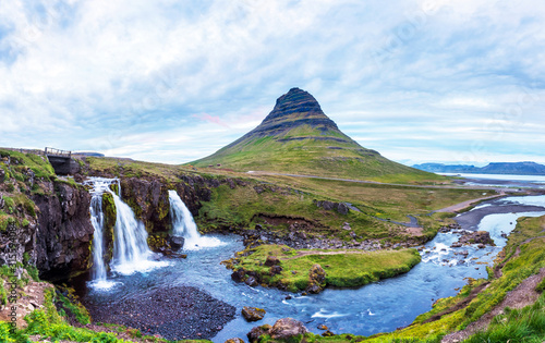 Obraz na płótnie Beautiful natural magical scenery with a waterfall Kirkjufell near the volcano in Iceland. Exotic countries. Amazing places. Popular tourist atraction. (Meditation, antistress - concept). w salonie