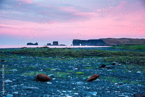 Obraz na płótnie majestic view from the black sand beach on Reynisdrangar Sea Cliffs at dawn on cape Dyrholaey near Vik, Iceland. Exotic countries. Amazing places. w salonie