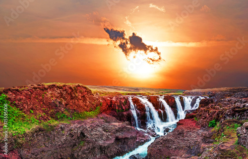 Beautiful mystical landscape with scorpion-shaped cloud over canyon Kolugljufur with water between the rocks in Iceland. Exotic countries. Amazing places. photo