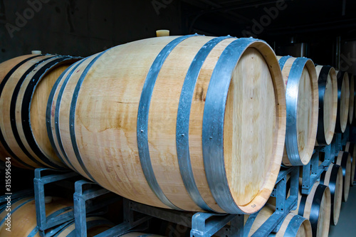 A view of a vineyard  vine barrels in cellar.