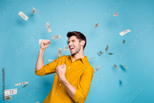 Photo of cheerful handsome attractive entrepreneur screaming with overjoyed feelings of victory isolated over pastel blue color background