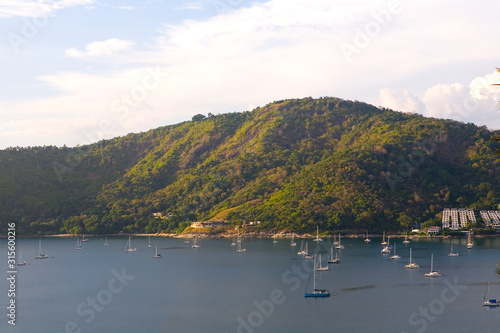 Yachts with lowered sails are in the bay. © Alexander